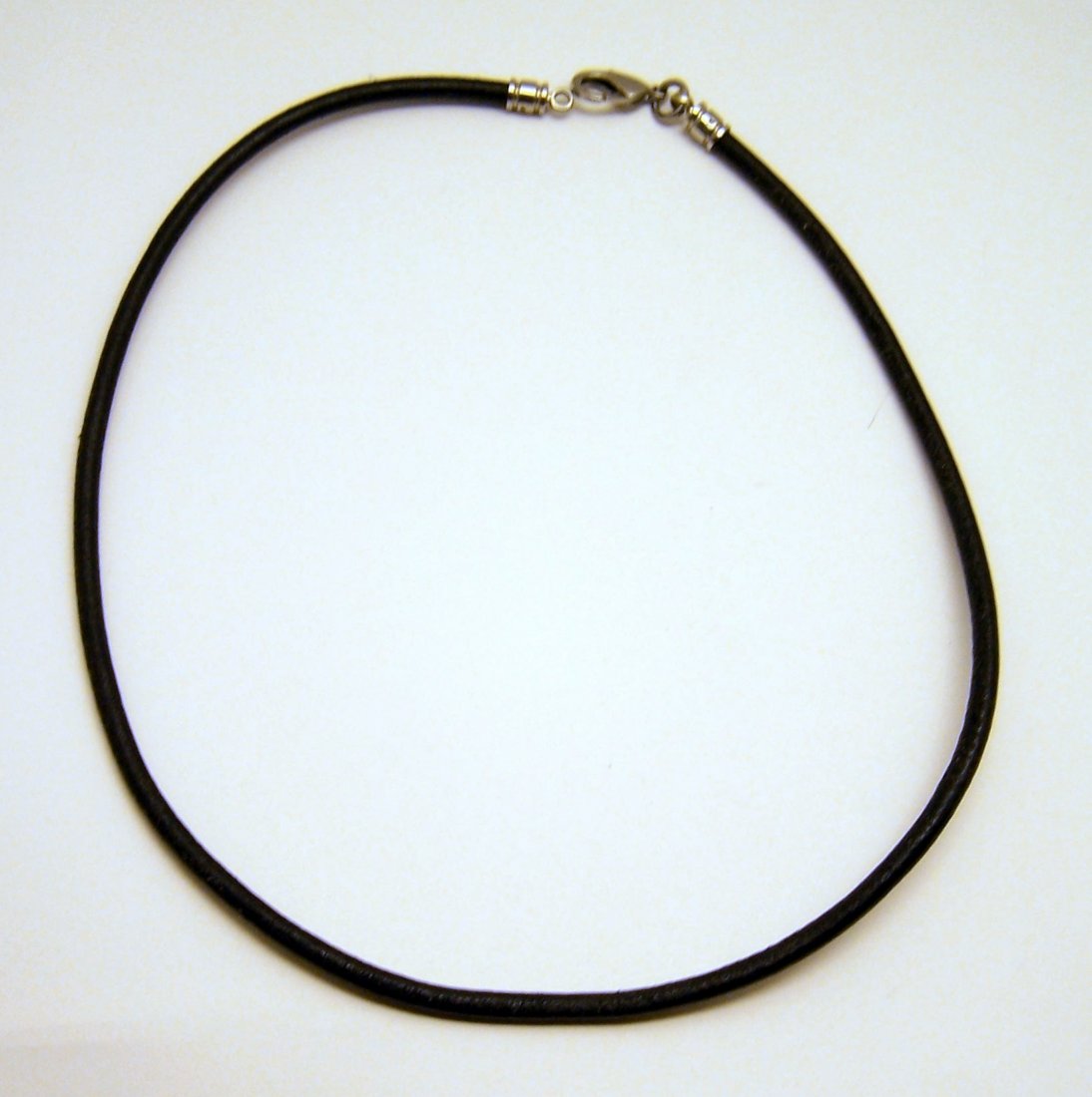designer stainless steel leather cord necklace: measures 19 3/4" long by 2/8" wide, marked with bvlgari but not sure if is genuine, weights 9.54 grams, in good condition.