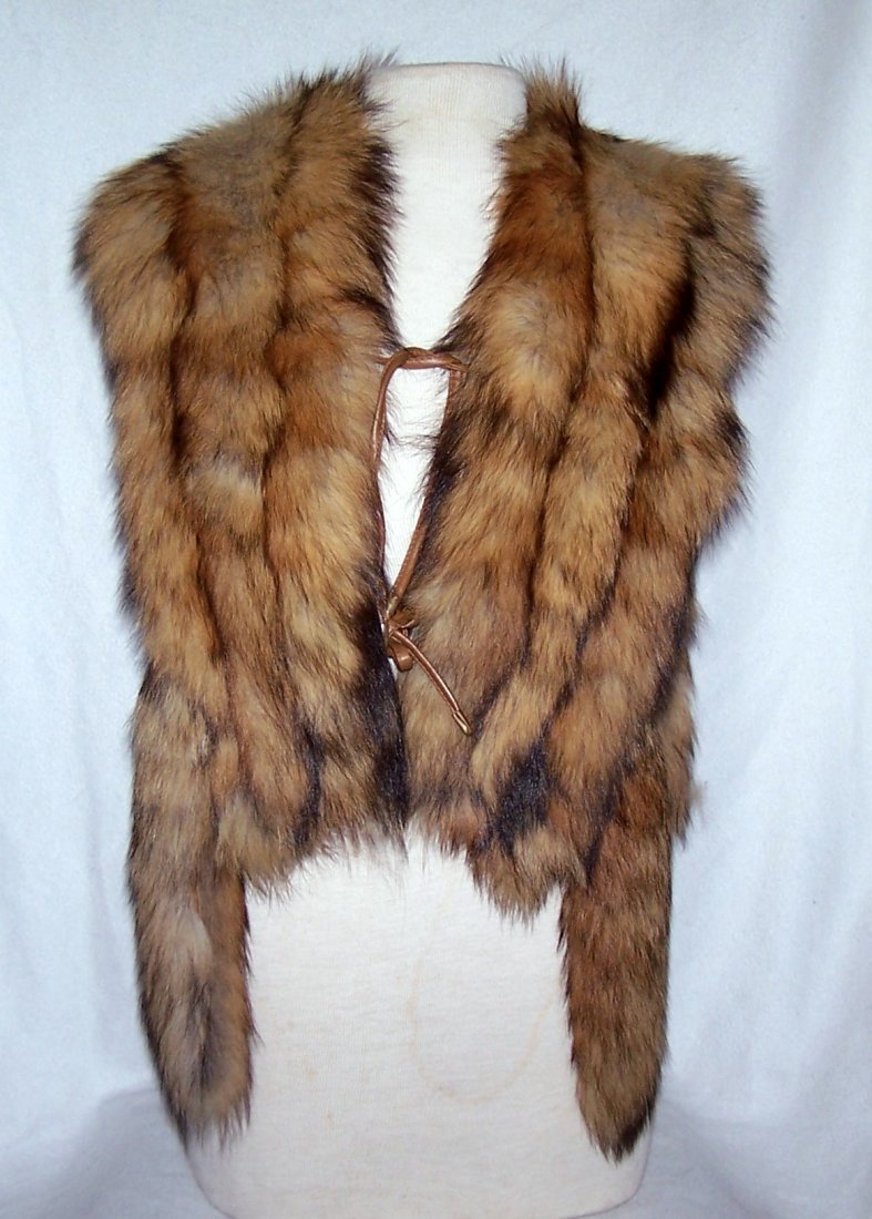 vintage JACQUES SAINT LAURENT fox fur vest: measures 14" long from armpit to armpit by 20" long from shoulder to hem, in good condition, note due this vest was not store property have some sign wear on the fur check pic for more info