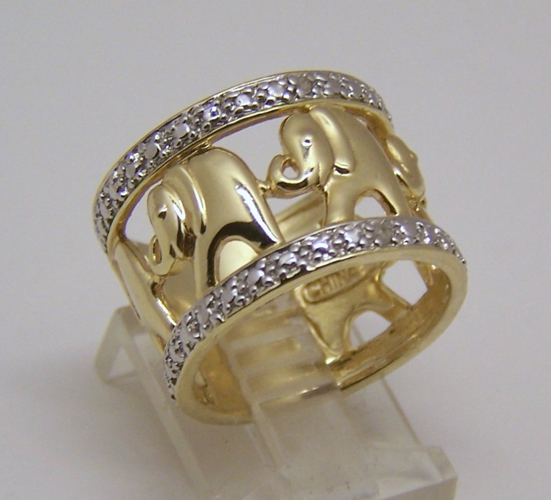 Ross Simons 18k over sterling silver diamond ring: top of the ring measures 9/16" wide, size 8 1/2, weights 7.59 grams, signed RS 925, crafted in 18k gold over sterling silver & few diamond chips, in great condition.