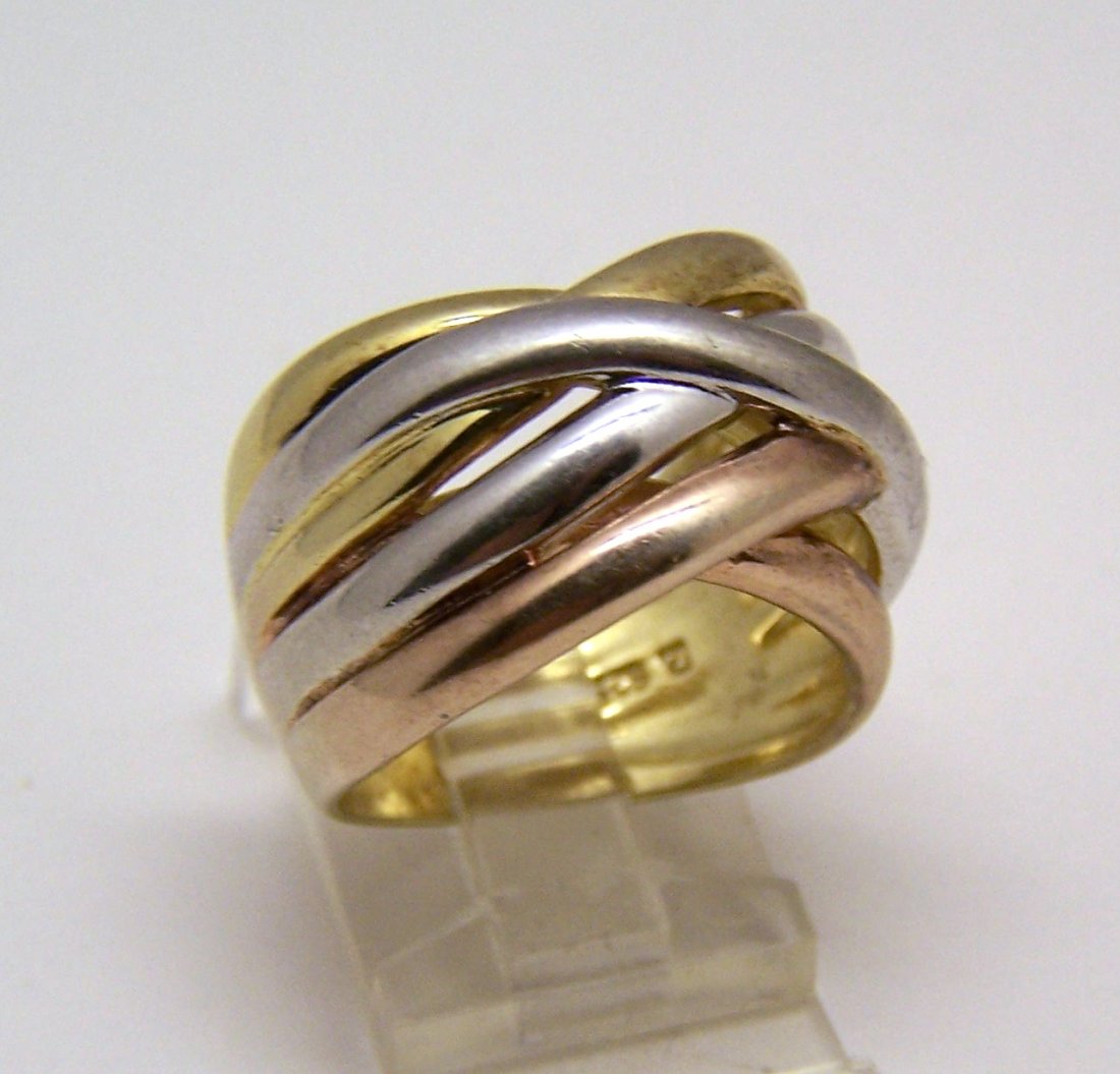 ross Simons 18k over sterling silver ring: top of the ring measure 9/16" wide, size 8 1/2, weights 9.46 grams, signed with rs 925, in good condition just have in the back a scratch where a previous seller tested as sterling silver.