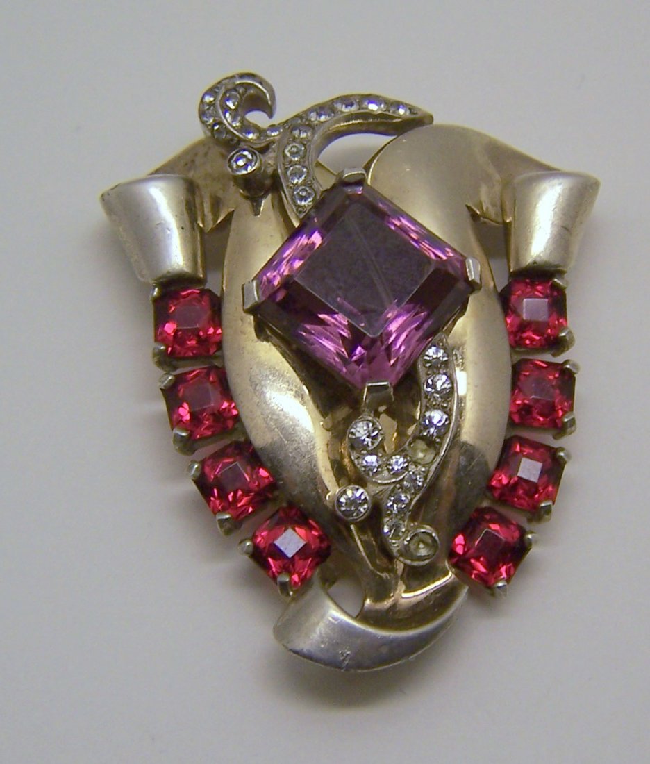 Art Deco sterling silver rhinestone fur clip brooch: measures 2 1/8" long by 1 6/8" wide, crafted with 2mm white rhinestone, 5x5mm ruby rhinestone, 14x14mm amethys rhinestone, signed sterling, weights 37.52 grams, in good condition but the purple rhines
