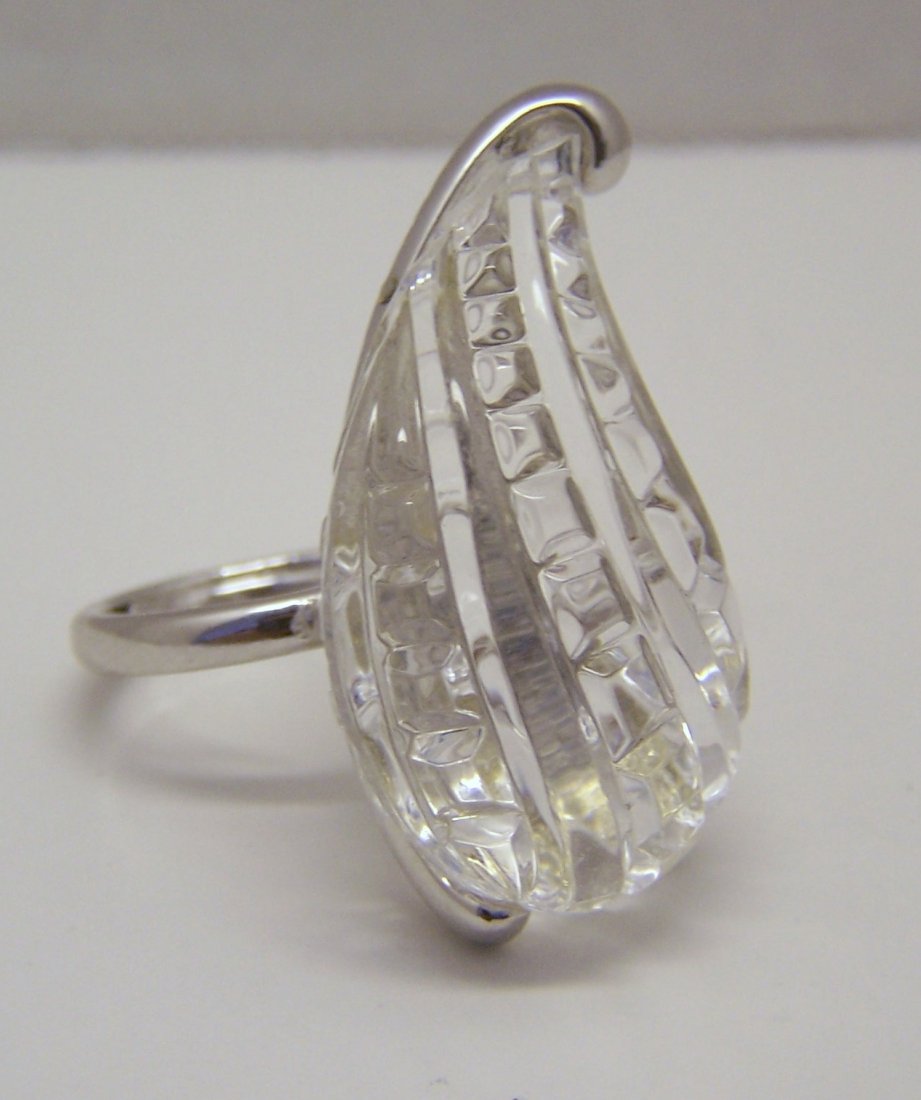 KENNETH JAY LANE carved clear lucite silver tone ring: top of the ring measures 15/16" long by 1 6/8" wide, crafted with 39x24mm clear carved lucite, can fit a size 5 to 6 1/2 because of the ring guard, weights 16.85 grams, signed Kenneth Lane, in great c