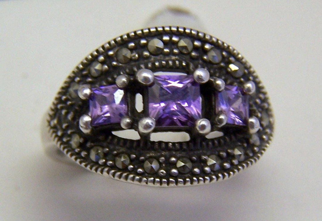 vintage amethyst marcasite sterling silver ring: top of the ring measures 6/8" long by 1/2" wide, crafted with 3x3mm to 4x4 amethyst & 1mm marcasites, size 5 3/4, weights 4.2 grams, signed 925, in great condition