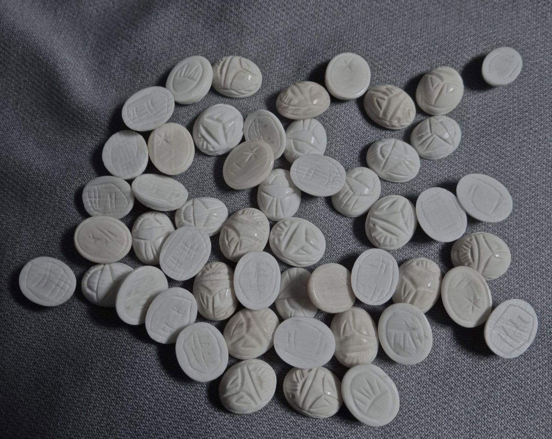 Art Deco 50 pieces of carved ivory scarab cabochon: you are bidding on 50 pieces of hand carved ivory scarabs cabochon, each measures aprox 9x12mm, in great condition