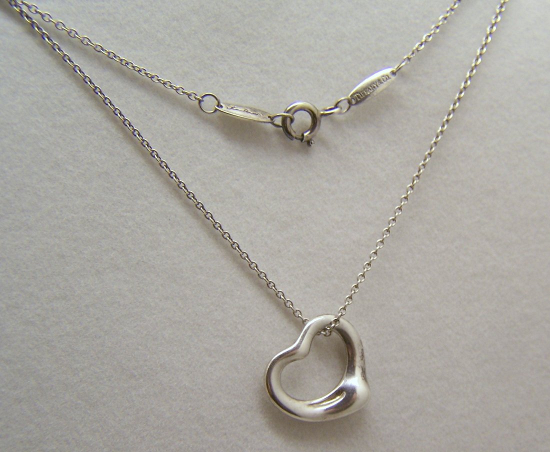Tiffany & Co. Elsa peretti sterling silver necklace: the chain measures 16" long, the pendant measures 9/16" long by 5/8" wide, weights 2.97 grams, signed tiffany & co elsa peretti 925 spain, in great condition