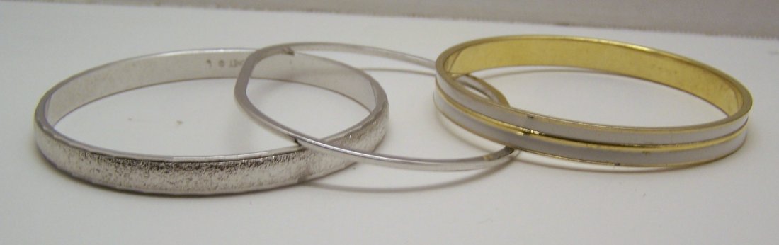 lot of 3 monet silver gold tone enamel bangle bracelet: you are bidding on 1 - 7 11/16" inside circumference, 1 - 8 1/8" inside circumference, 1 - 7 1/2" inside circumference, they are in great condition.