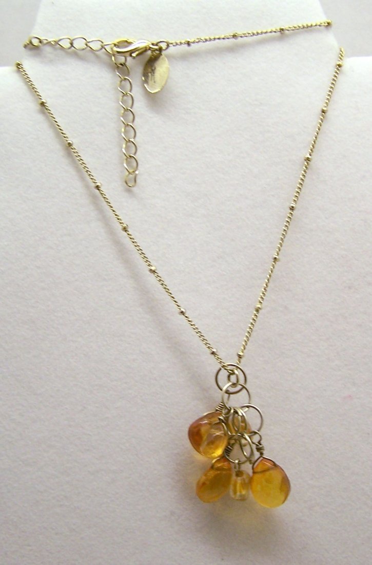 LAILA ROWE gold tone amber necklace: measures 18" long crafted with 8x5mm yo 11x12mm amber beads, weights 7.37 grams, signed laila rowe, in great condition