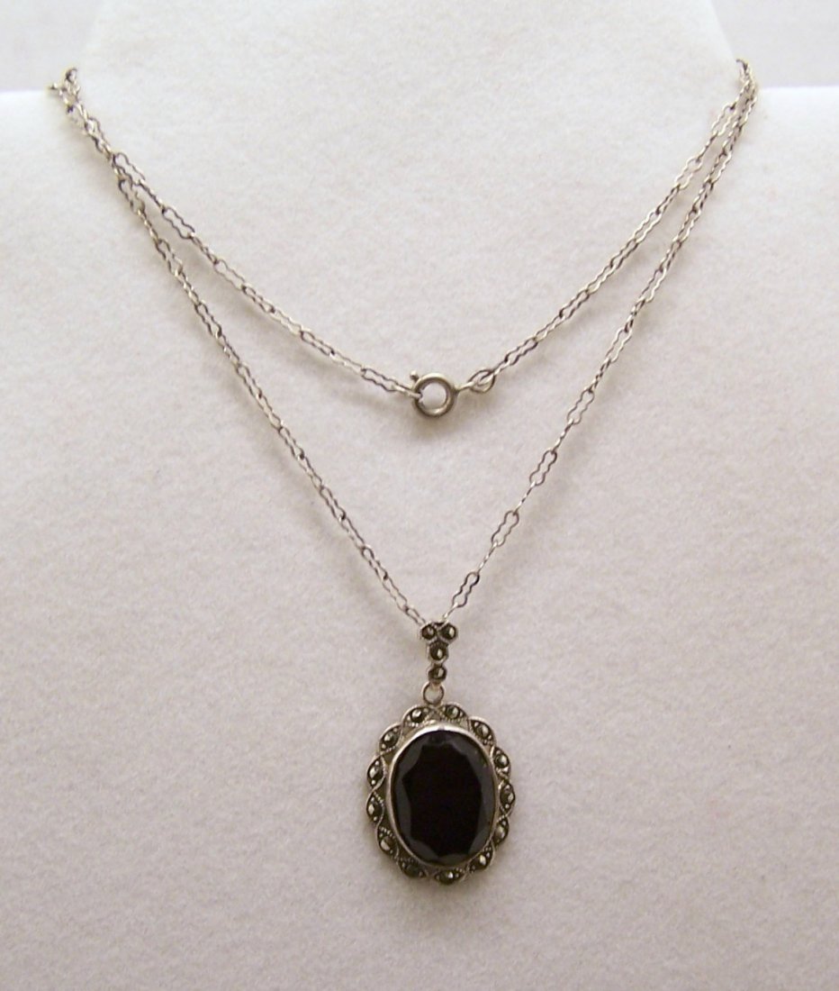 Art Deco sterling silver marcasite onyx necklace: pendant measures 1 2/8" long by 11/16" wide, crafted 15x12mm onyx & marcasites. the chain measures 17 3/4" long. combine shipping of 4.2 grams, marked ster, in good condition