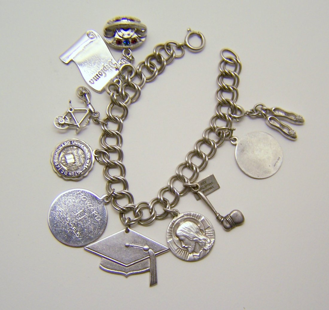 vintage sterling silver HOWARD student charm bracelet: measures 7 1/4" long, crafted with Monet ballerina shoes charm, sterling silver pendant, sterling silver sky line drive Virginia charm, I am an Episcopalian steering silver medal. sterling silver carv