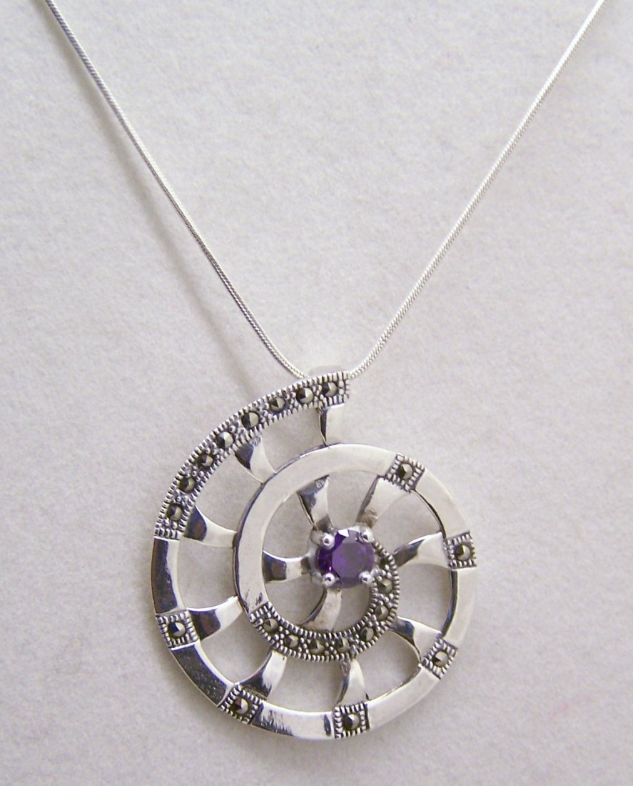 sterling silver amethyst marcasite pendant necklace: pendant measures 1 1/2" long, chain measures 16 3/8" long, weights 10.1 grams, signed 925, in great condition