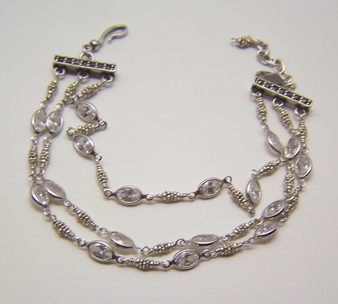 aquarian thoughts sterling silver cz marcasite bracelet: measures 7 3/4" long, crafted with marcasites & 6x3mm marquise Cz, weights 11 grams, signed Aquarian thoughts 925, in great condition