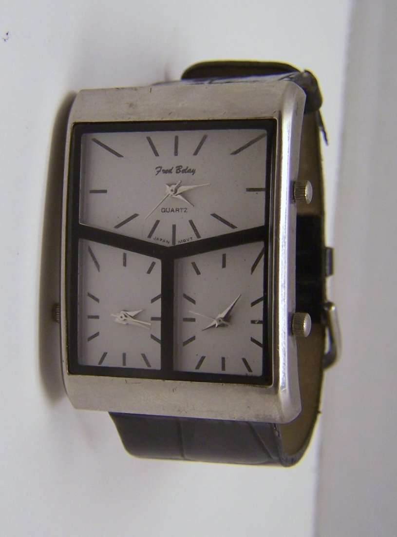 FRED BELAY oversize woman watch: watch case measures 2" long from lug to lug & 1 7/16" wide not including the crowns, this watch need a battery and may need a new watch band.