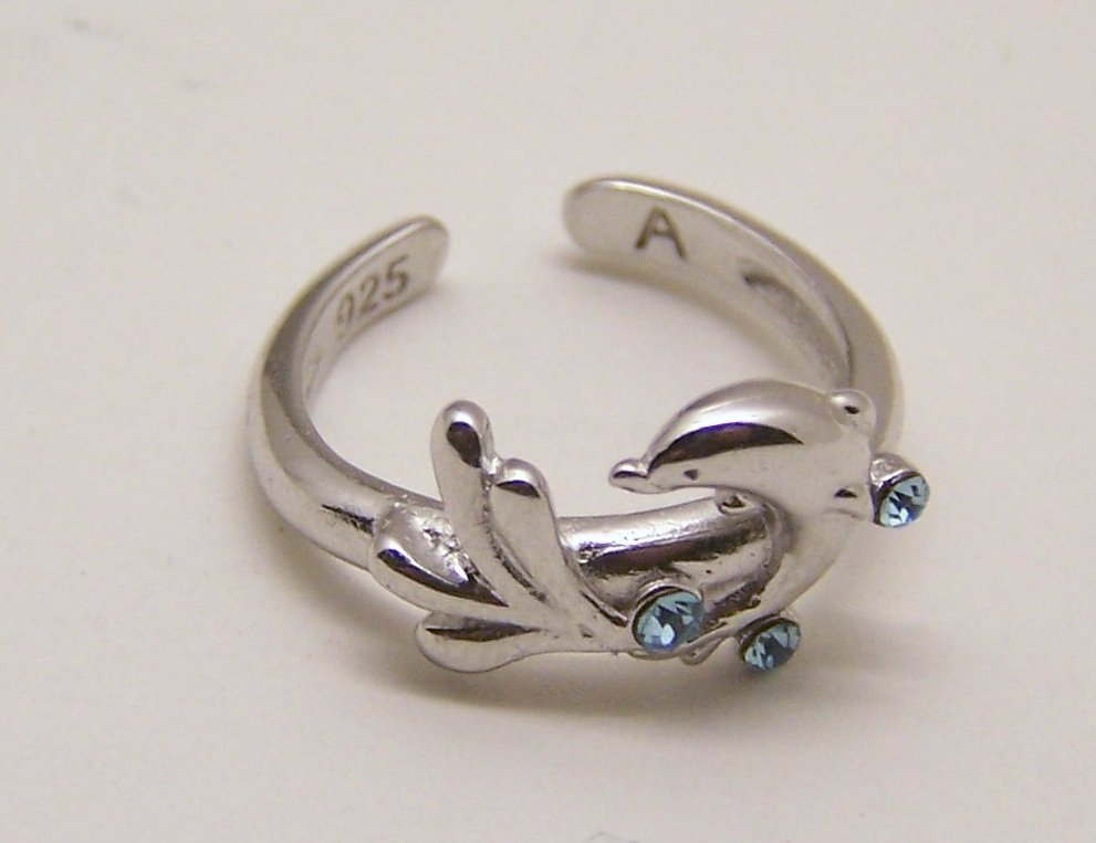sterling silver crystal dolphin ring: top of the ring measures 3/8" wide, size 5, weights 1.85 grams, signed 925, in good condition.