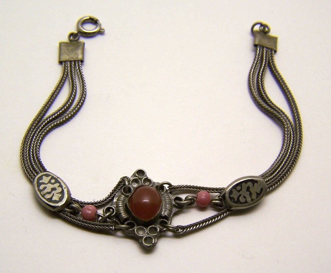 sterling silver carnelian enamel bracelet: measures 7 3/8" long by 7/8" wide, crafted with 9x7mm carnelian, weights 10.89 grams, signed 925, in good condition