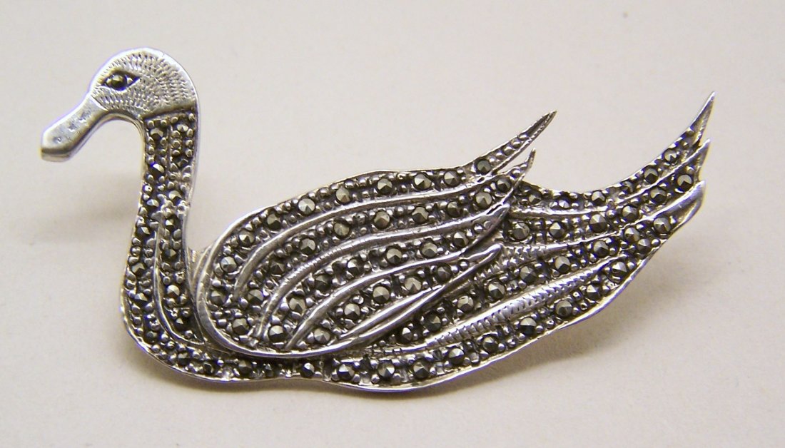 Art Deco sterling silver marcasite swan brooch pin: measures 2 3/16" long by 1 1/8" wide. weights 14.5 grams, marked Sterling, in good condition.