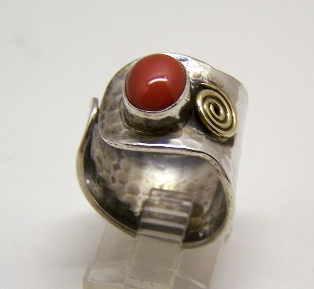 sterling silver coral ring: top of the ring measures 6/8" wide, crafted with 9x7mm coral, size 9, weights 6.3 grams, signed 925, in great condition