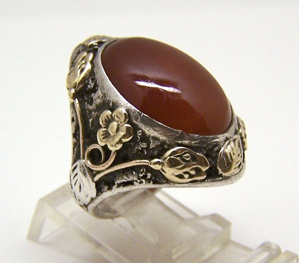 Art Nouveau 14k sterling silver carnelian ring: top of the ring mesures 1 1/8" wide, crafted with 19x13mm carnelian, size 5 1/2, weights 13.26 grams, signed sterling & the flowers been tested as 14k gold, in great condition