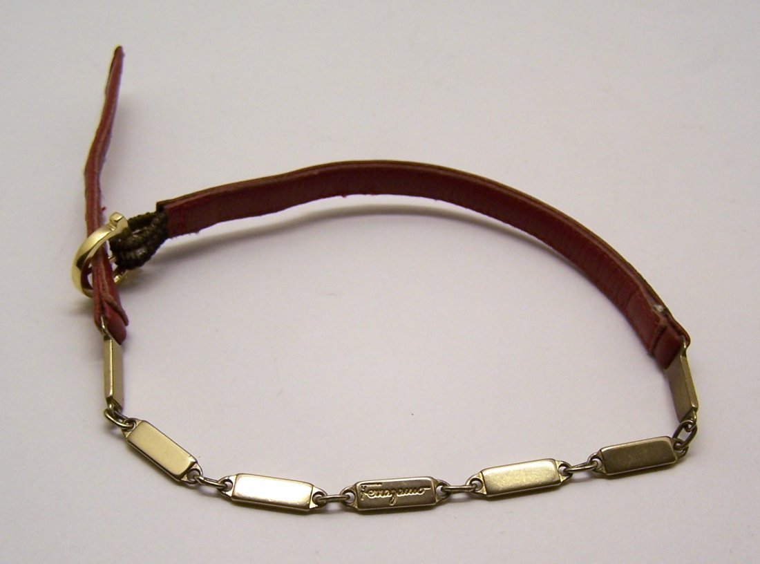 FERRAGAMO leather gold tone arm bracelet: measures 10 1/2" long by 1/4" wide, weights 6.12 grams, in good condition