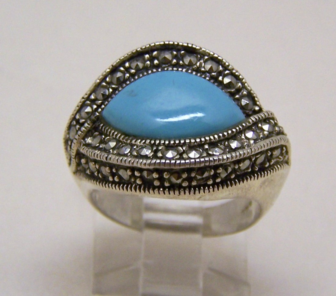 vintage sterling silver marcasite turquoise ring: top of the ring measures 7/8" long by 11/16" wide, crafted with 14x7mm turquoise & 1mm marcasite, size 6, weights 8.3 grams, marked 925, in great condition.