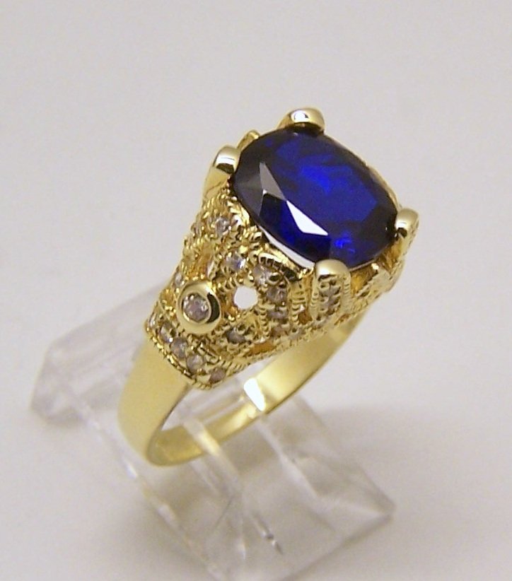 JBK sterling silver Cz ring: top of the ring measures 1/2" wide, size 8 1/2, crafted with 10x8mm blue Cz, weights 6.67 grams, signed JBK 925, in great condition