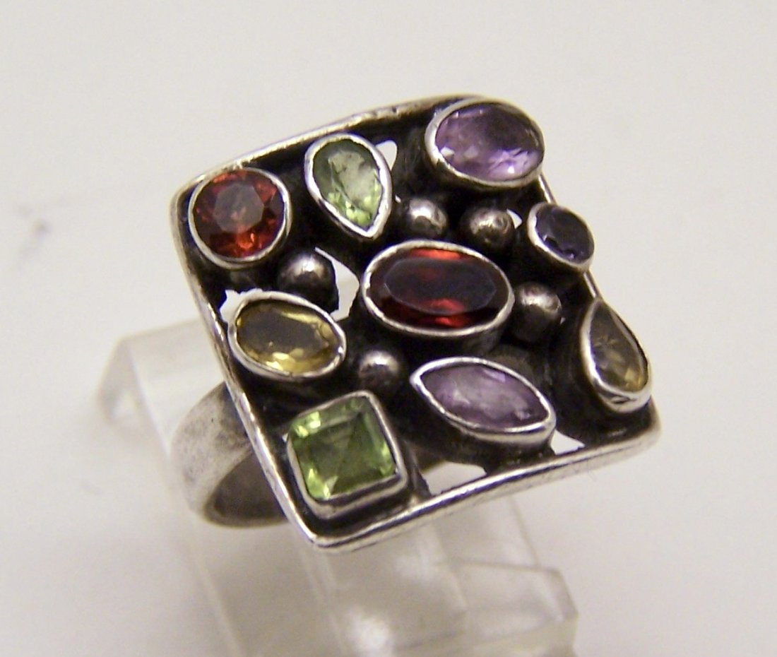 sterling silver gemstone ring: top of the ring measures 6/8" wide, crafted with 3mm to 6x4mm amethyst, peridot, garnet & citrine gemstones, size 6 1/4, weights 8.79 grams, 925, in great condition