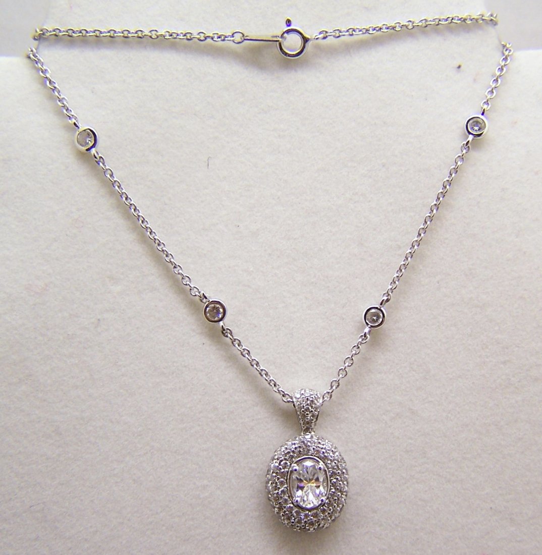 CO sterling Cz by the yard cluster pendan necklace: pendant measures 1" long by 9/16" wide, crafted with 1mm to 7x5mm white Cz, the Cz by the yard chain measures 16" long & crafted with a 3mm Cz, weights 7.12 grams, signed 925 Co, in great condition