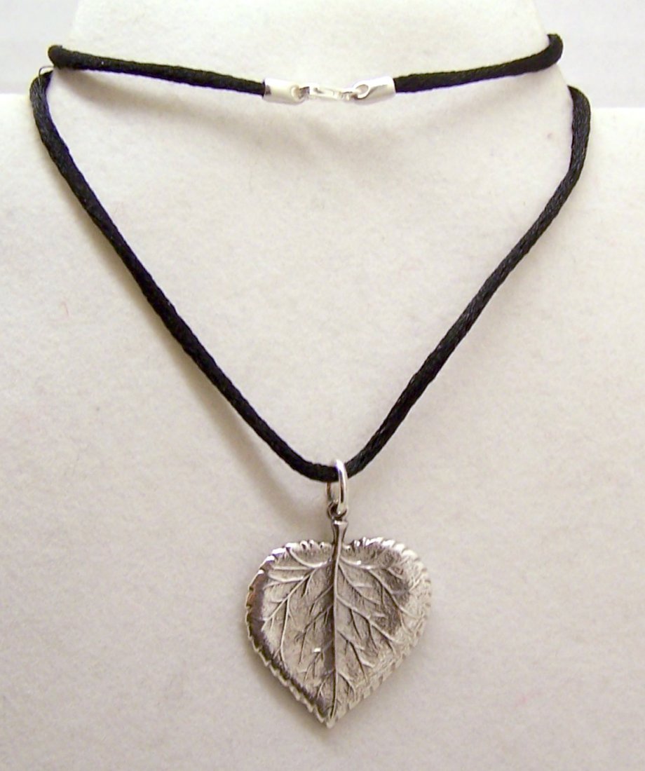 BUCCELLATI Gianmaria sterling silver silk cord necklace: pendant measures 1 9/16" long by 1 1/8" wide, silk cord measures 16 1/8" long, combine weight of 8.79 grams, signed Buccellati Sterling Italy, in great conditionl