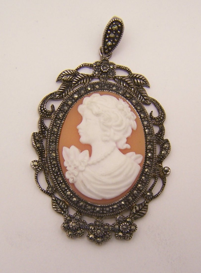 sterling silver cameo marcasite pendant: measures 2 3/8" long by 1 3/8" wide, crafted with 27x21mm cameo, weights 10 grams, signed 925, in great condition