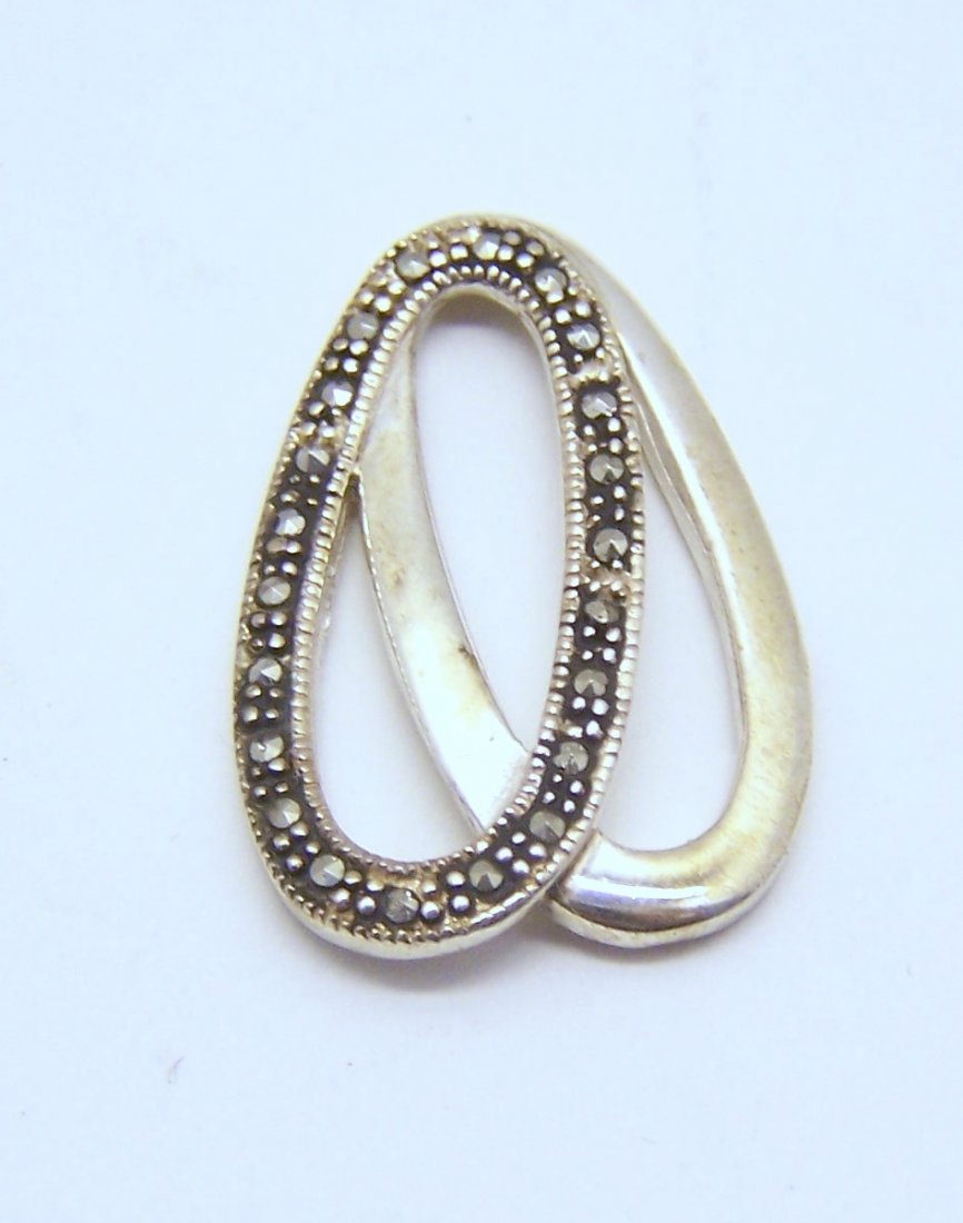 sterling silver marcasite pendant: measures 1 3/16" long by 13/16" wide, weights 4.28 grams, signed 925, in great condition