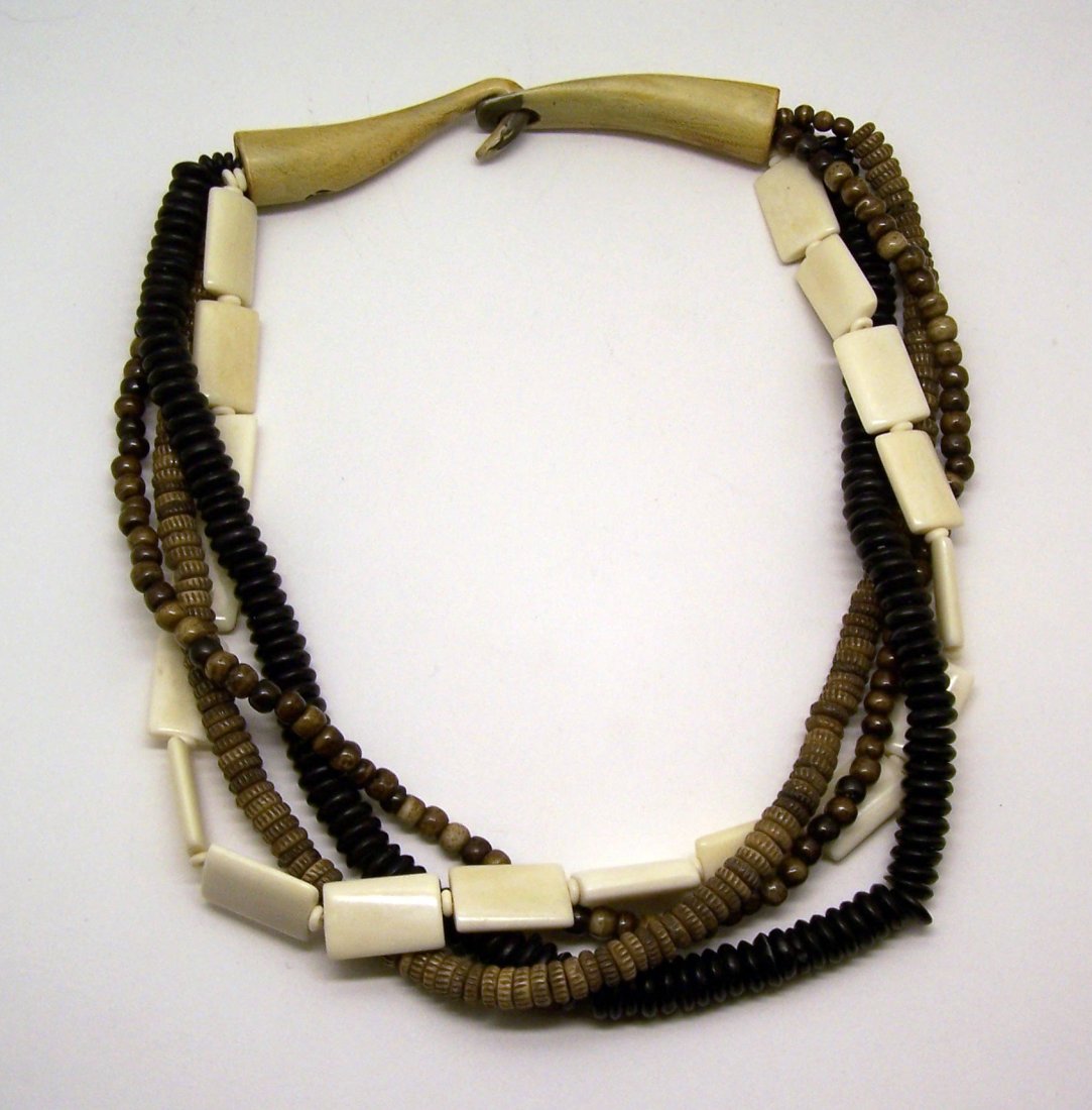 vintage wood bone beads necklace: measures 22 1/2" long crafted with 4 strands of 6mm to 8mm wood beads & 10mm to 22x15mm bone beads, weights 177 grams, in good condition