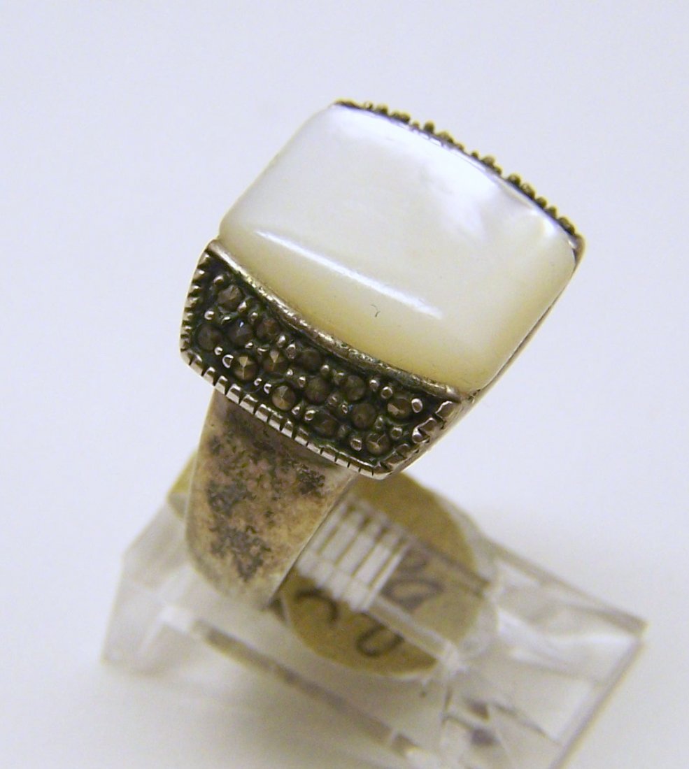 vintage mother pearl, marcasite ring: top of the ring measures 9/16" wide, crafted with 14x11mm mother of pearl, size 5, weights 8.4 grams, good condition
