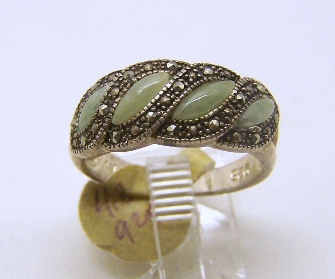 AN sterling silver marcasite jade ring: top of the ring measures 3/8" wide, crafted with jade & marcasites, size 8, weighs, 4.8 grams, in good condition