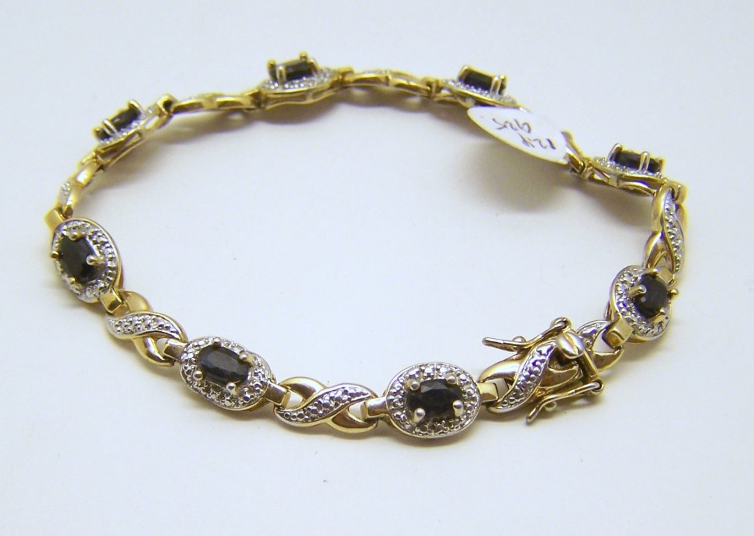 Ross Simons 18k over sterling silver sapphires bracelet: measures 7 1/2" long, crafted with 6x4mm sapphires, weights 12 grams, in great condition