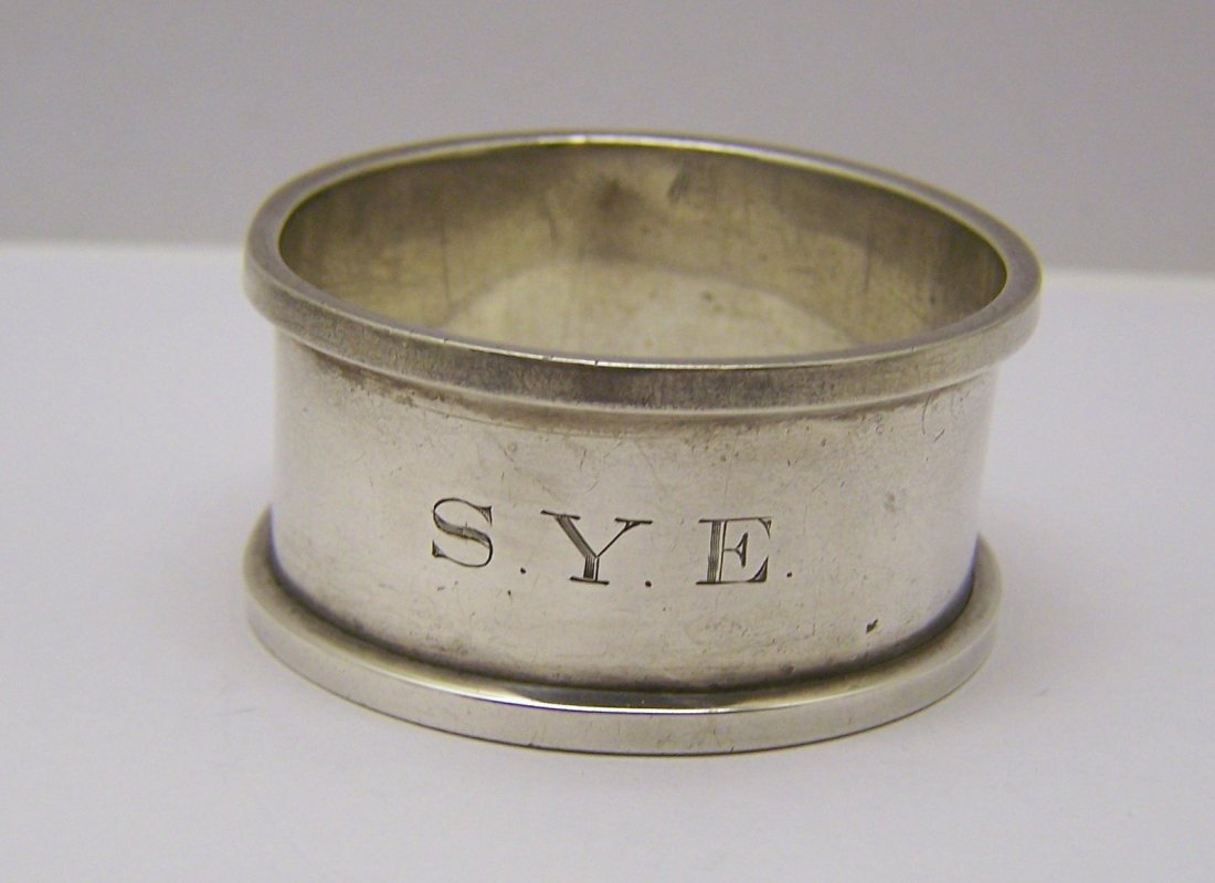 vintage sterling silver napkin ring: measures 1 6/8" in diameter & 7/8" high, engrave it SYE, sterling makers hallmark 8812, weights 17.9 grams, in good condition.