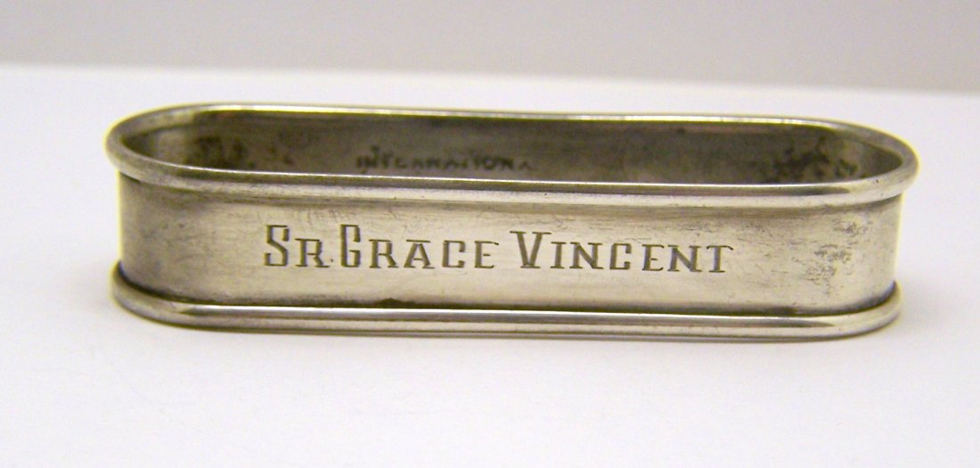 INTERNATIONAL sterling silver napkin ring: measures 2 11/16" long by 7/8" wide & 9/16" high, engrave SR GRACE VINCENT, sterling makers hallmark INTERNATIONAL N 140, weights 16 grams, in good condition.