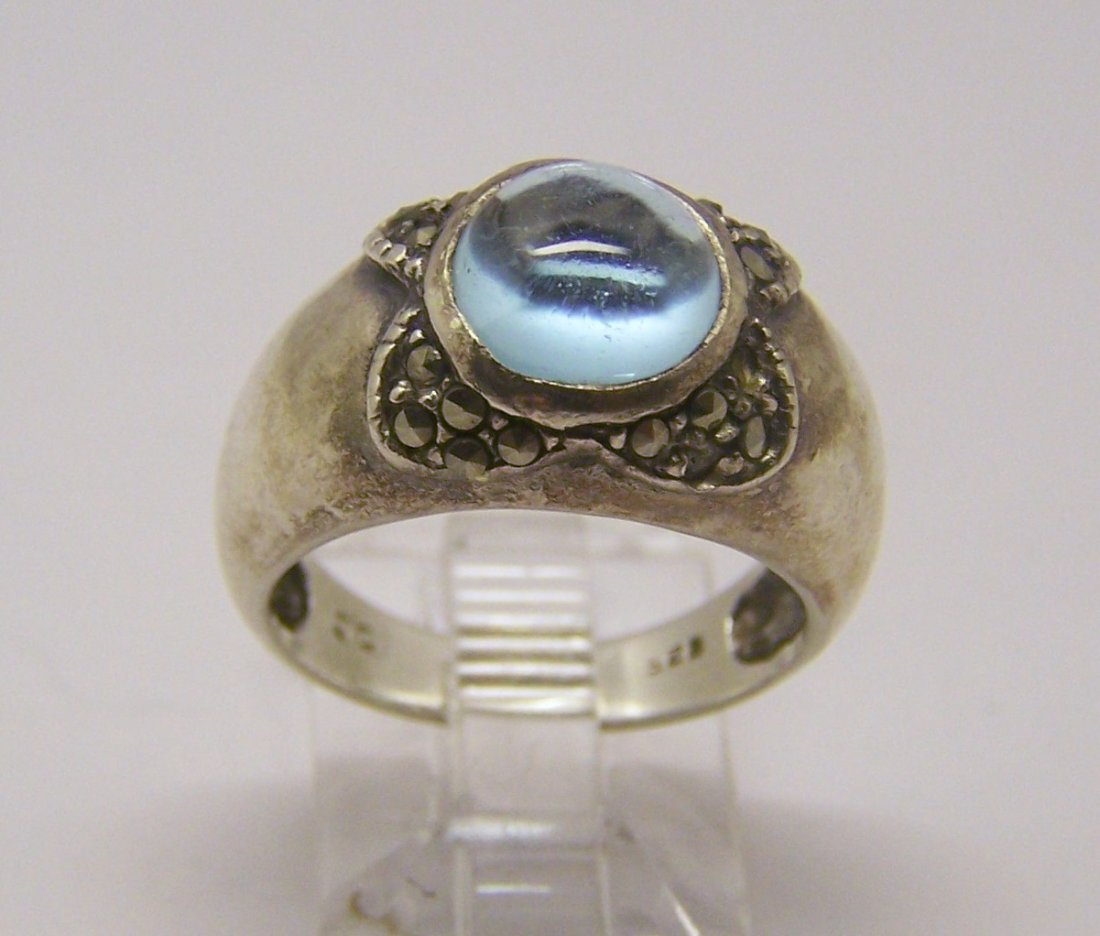 JC marcasite blue topaz cabochon ring: top of the ring measures 7/16" wide, crafted with 8mm blue topaz cabochon, size 6 1/4, weights 5.4 grams, in great condition