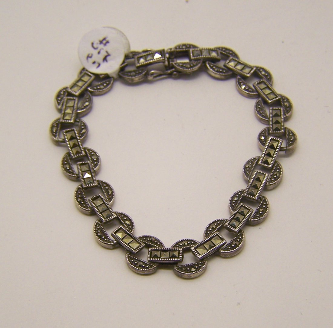 vintage sterling silver marcasite bracelet: measures 7 5/8" long by 7/16" wide, weights 18 grams, in good condition