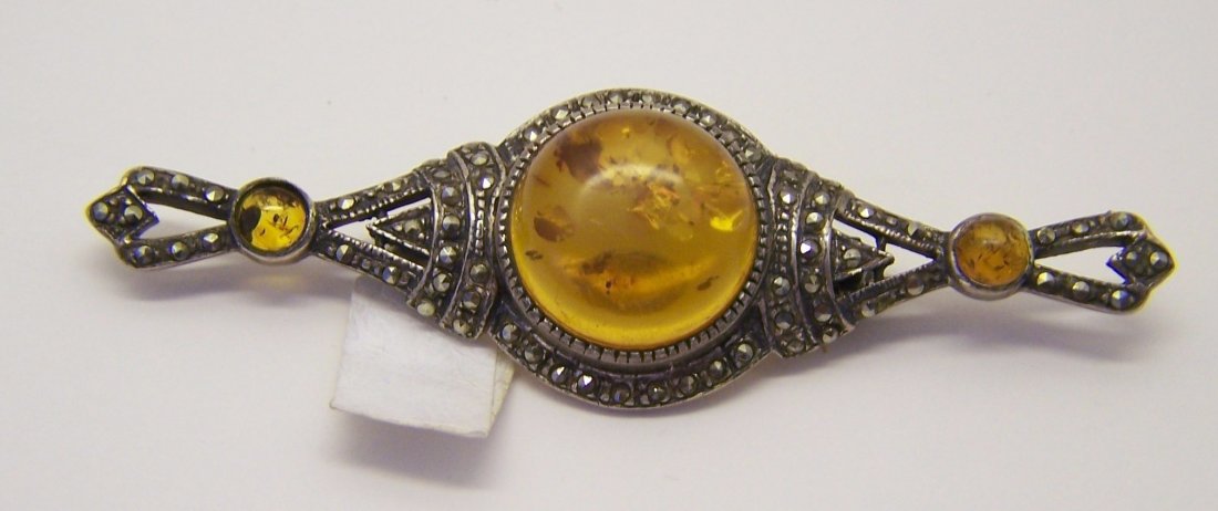 sterling silver marcasite baltic amber brooch pin: measures 3 1/16" long by 15/16" wide, crafted with 5mm to 17mm baltic amber & marcasite, weights 13.97 grams, in great condition