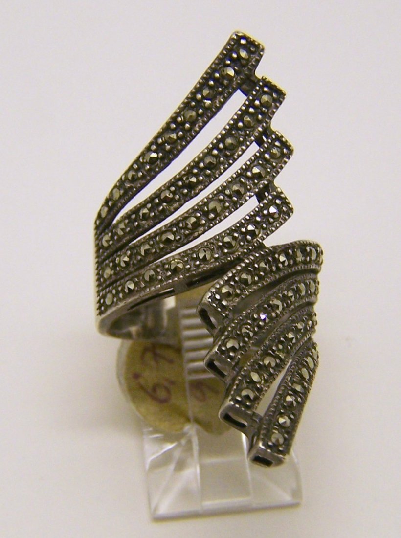 sterling silver marcasite ring: top of the ring measures 1 1/2" wide, size 6 1/2, weights 6.7 grams, in good condition