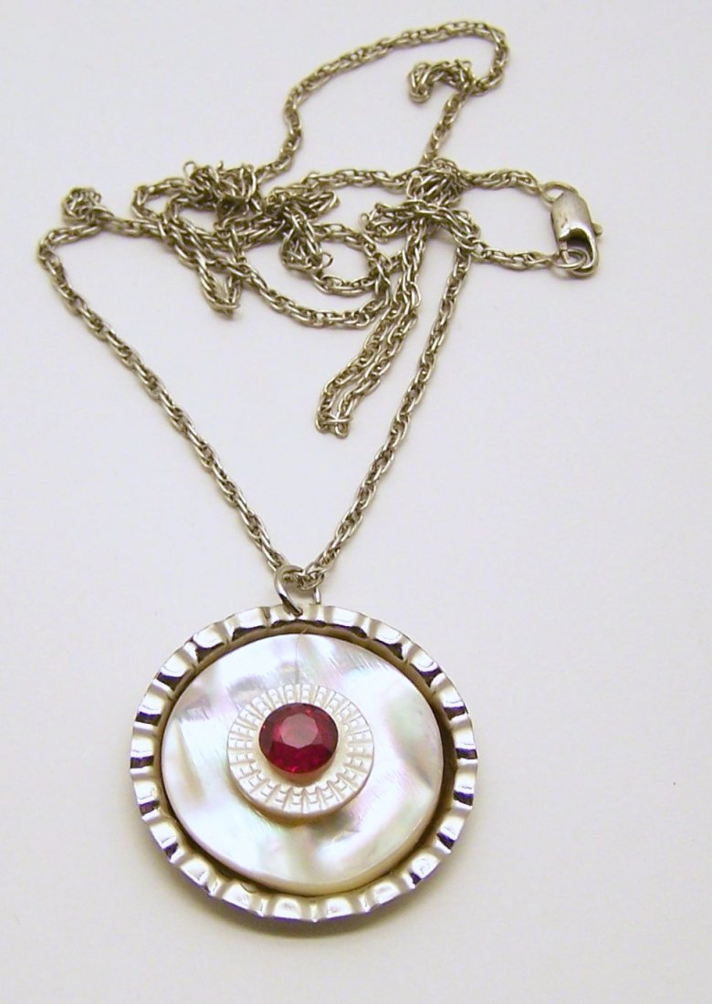 sterling mother of pearl ruby pendant necklace: silver tone pendant measures 1 5/8" long, chain measures 24" long, weights 10 grams, in great condition