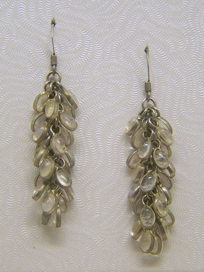 sterling silver moonstone drop earrings: mesures 2 3/8" long, crafted with 6x4mm moonstone, weights 10 grams, in good condition