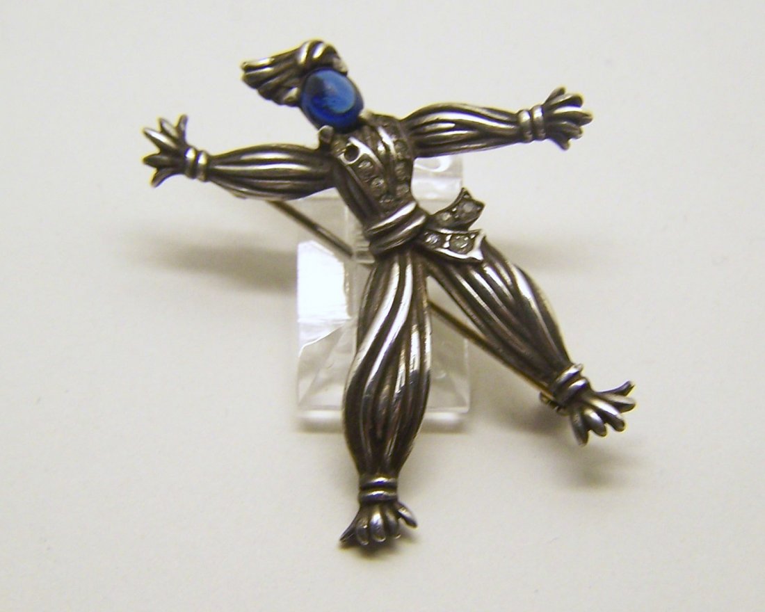 TRIFARI sterling silver rhinestone brooch pin: measures 17 3/41 5/8" long by 1 9/16" wide, crafted with 4x4mm sapphire glass cabochon, weights 10.6 grams,signed Trifari patent no 138080 sterling, in good conditio, missing 1 rhinestone.