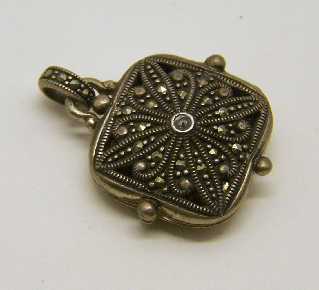 vintage sterling silver marcasite locket pendant: measures 1 3/16" long by 15/16" wide, weights 10.3 grams, in great condition