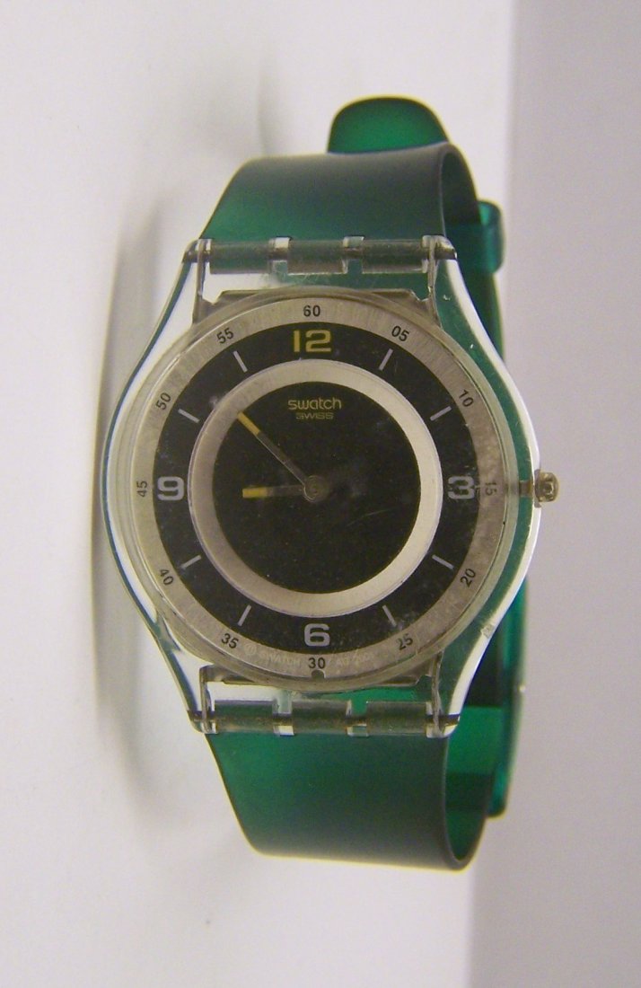 SWATCH unisex watch: watch case mesures 1 1/2" long from lug to lug by 1 5/16" wide not included the crown, 8" long, in good condition need a battery and have some scruffs on the crystal from use.