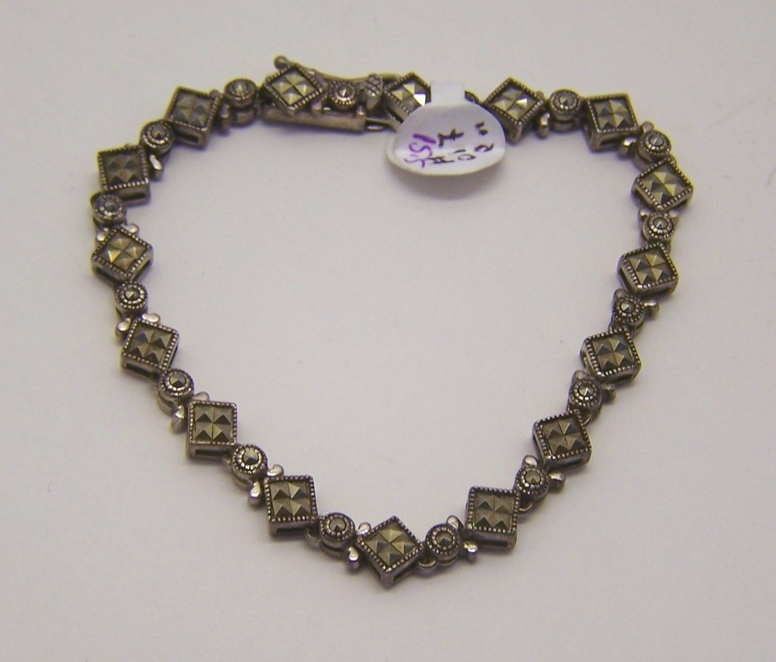 vintage sterling silver marcasite bracelet: measures 7 1/2" long by 1/4" wide, crafted with marcasite, weights 15.5 grams, in great condition