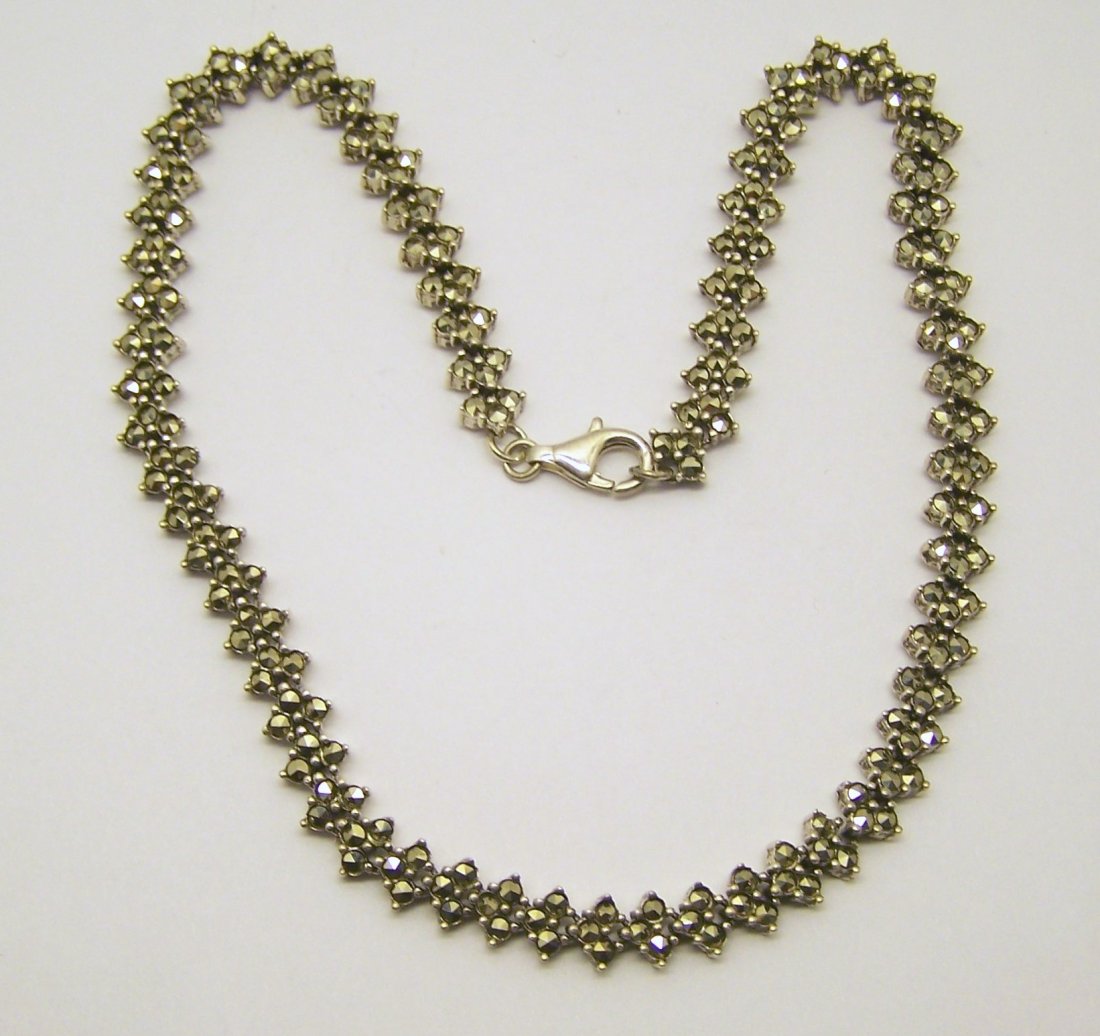 vintage sterling silver marcasite necklace: measures 15" long but can be add a chain extender to make it longer by 5/16" wide, crafted with marcasite, weights 32.5 grams, signed 925, in great condition