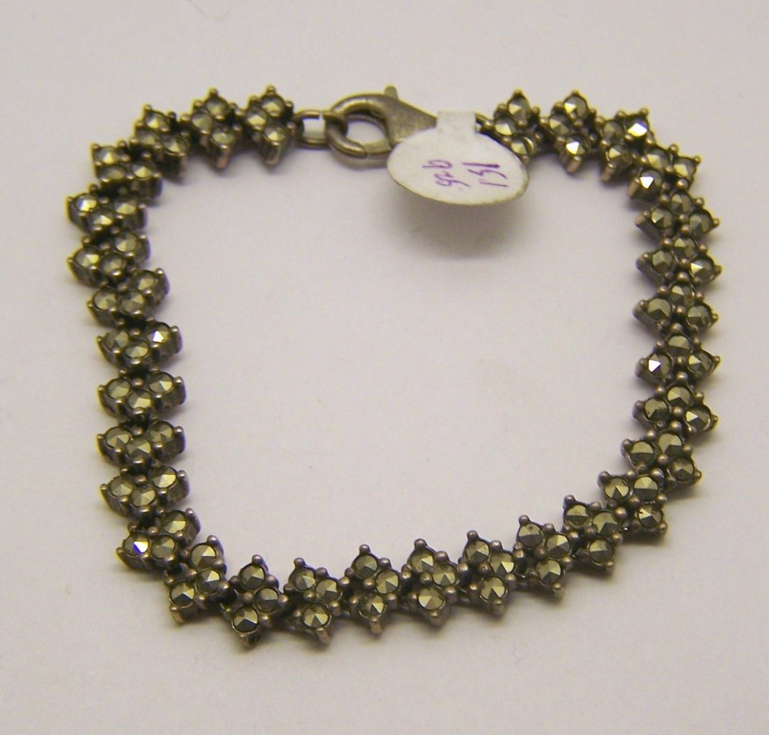 vintage sterling silver marcasite bracelet: measures 7" long by 5/16" wide, crafted with marcasite, weights 15.1 grams, signed 925, in great condition