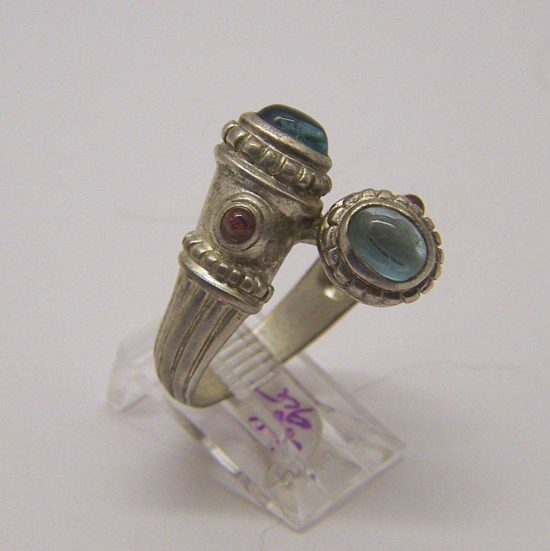 sterling silver topaz garnet ring: top of the ring measures 13/16" wide, crafted with 6x4mm topaz & 2mm garnet, size 9, weights 6.8 grams, in good condition