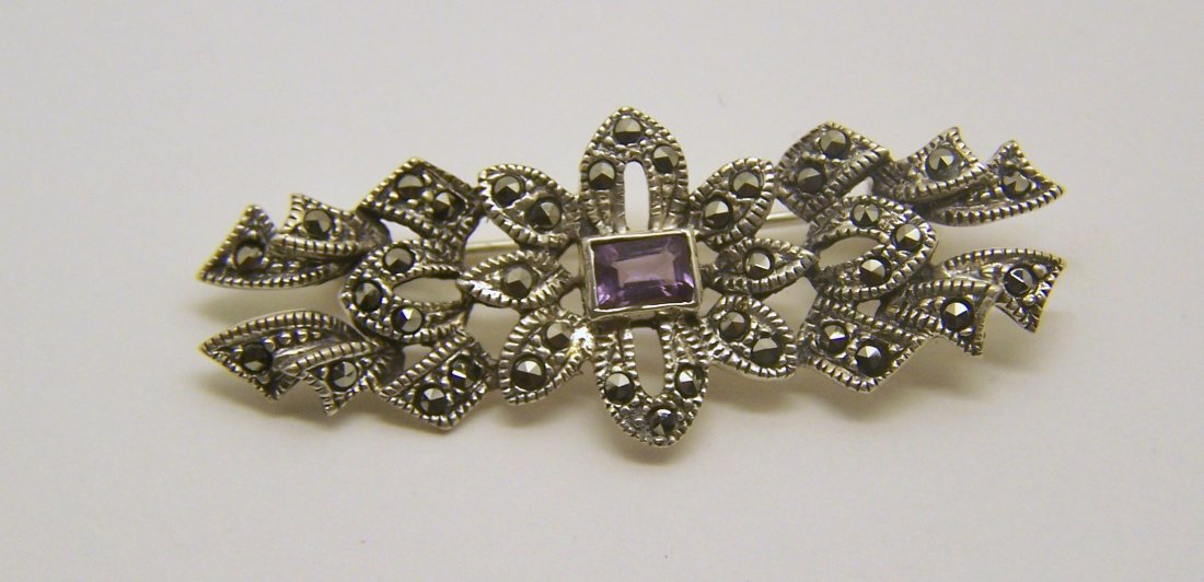 vintage sterling silver amethyst marcasite brooch pin: measures 1 13/16" long by 11/16" wide, crafted with 5x3mm amethyst, weights 5.4 grams, in great condition