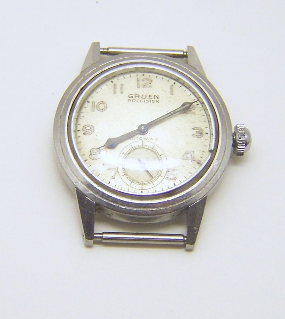 vintage GRUEN precision autowind men watch: watch case measures 1 1/2" long from lug to lug to 1 1/4" wide not including the crown, in good wotking condition